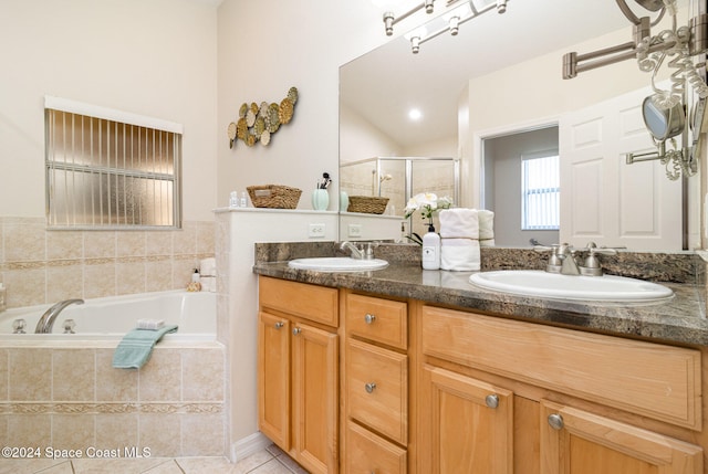 bathroom featuring tile patterned floors, vanity, and plus walk in shower