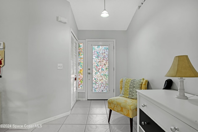 doorway to outside featuring light tile patterned floors