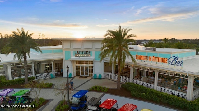 view of outdoor building at dusk