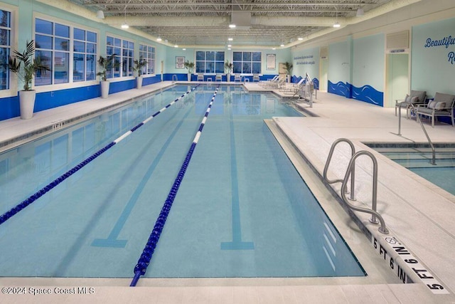 view of swimming pool with a patio area