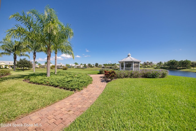 view of yard featuring a water view and a gazebo