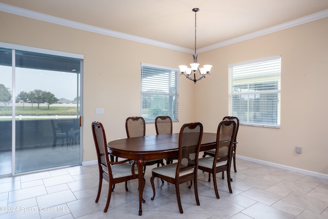 tiled dining room with a notable chandelier and ornamental molding