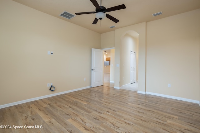 unfurnished room with ceiling fan and light wood-type flooring