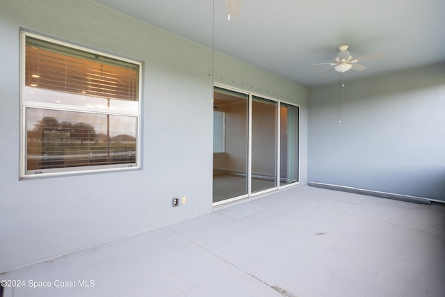 view of patio featuring ceiling fan