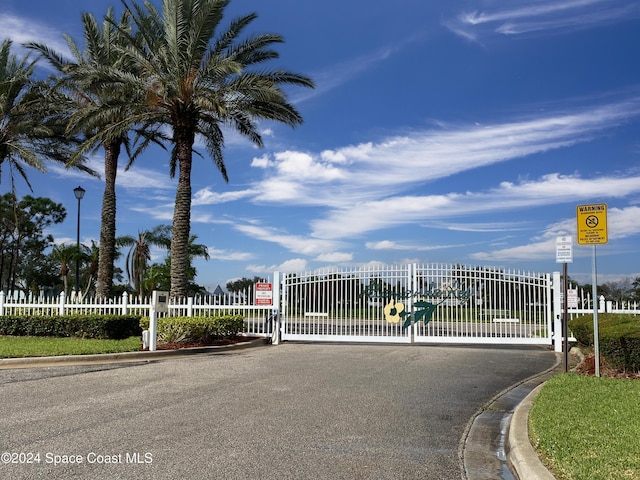 view of gate with fence