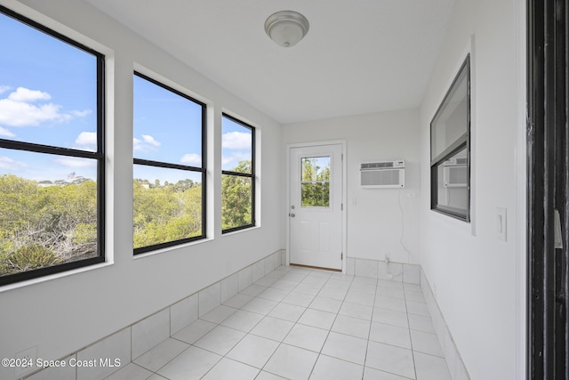 750 W Whitmire Dr, Melbourne, FL 32935 - unfurnished sunroom featuring a wall mounted air conditioner