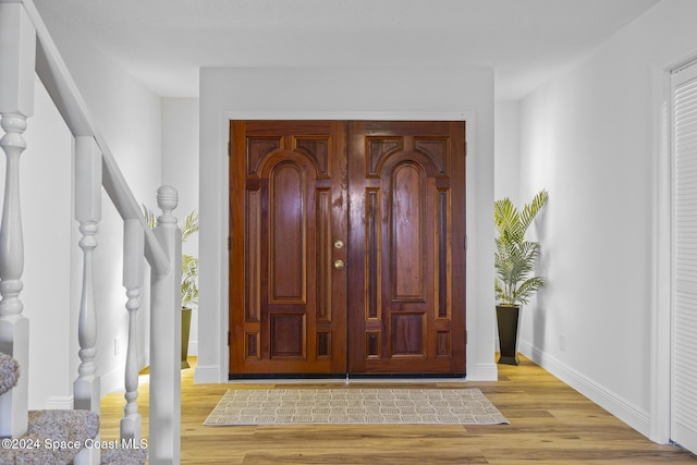 750 W Whitmire Dr, Melbourne, FL 32935 - entrance foyer featuring wood finished floors, stairway, and baseboards