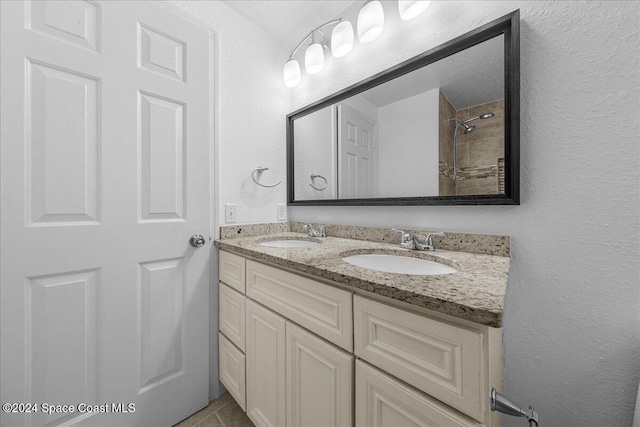 bathroom with vanity and walk in shower