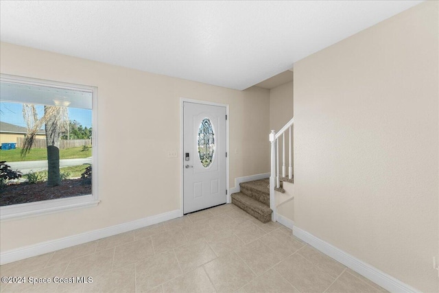 foyer entrance featuring plenty of natural light