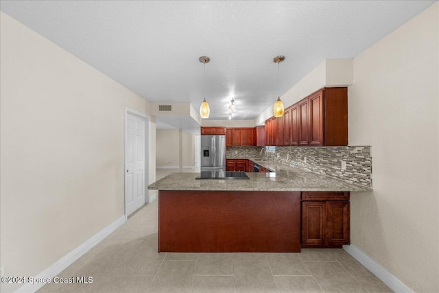 kitchen with kitchen peninsula, decorative backsplash, hanging light fixtures, stainless steel fridge with ice dispenser, and black electric cooktop