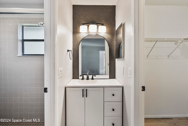 bathroom featuring vanity and hardwood / wood-style flooring