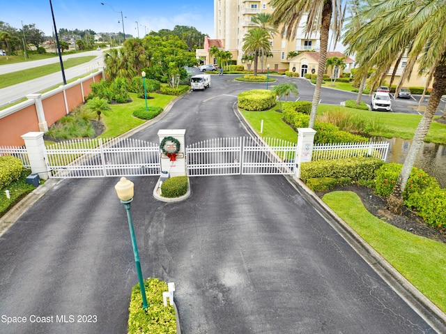 4975 Dixie Hwy NE Unit 201, Palm Bay, FL 32905 - view of asphalt street with a gate and curbs