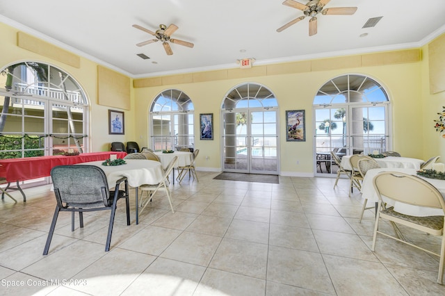 4975 Dixie Hwy NE Unit 201, Palm Bay, FL 32905 - dining area with ceiling fan, ornamental molding, tile patterned flooring, and baseboards