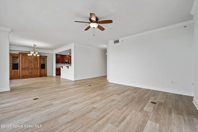 4975 Dixie Hwy NE Unit 201, Palm Bay, FL 32905 - unfurnished living room featuring a chandelier, ceiling fan, crown molding, light wood-style flooring, and baseboards
