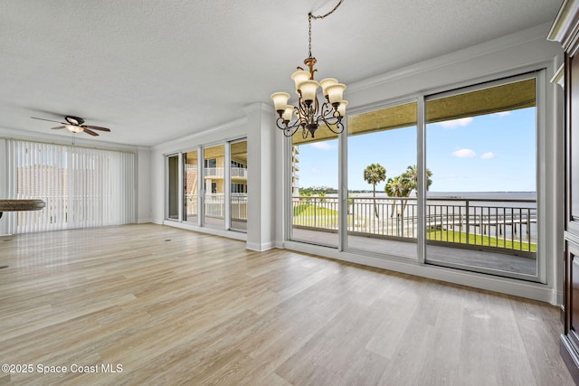 4975 Dixie Hwy NE Unit 201, Palm Bay, FL 32905 - unfurnished room featuring a textured ceiling, a chandelier, light wood-style flooring, and ceiling fan