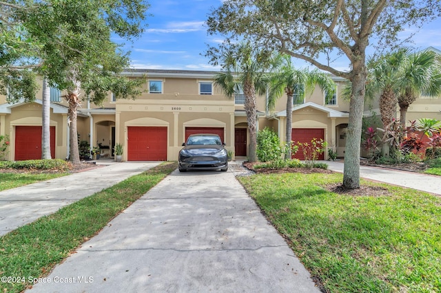 mediterranean / spanish house featuring a front lawn