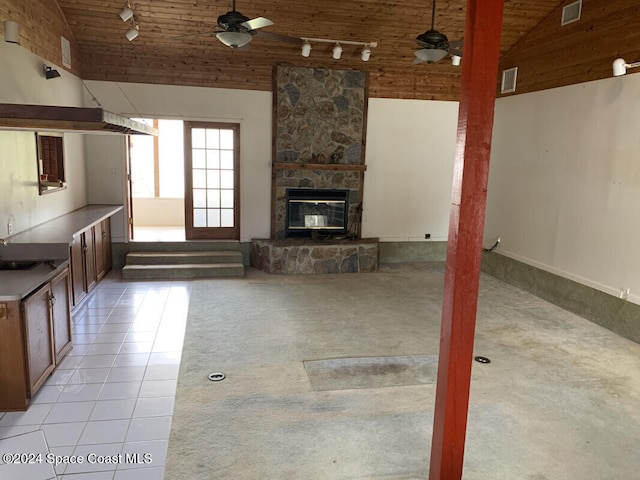 unfurnished living room featuring light tile patterned flooring, wood ceiling, high vaulted ceiling, and ceiling fan