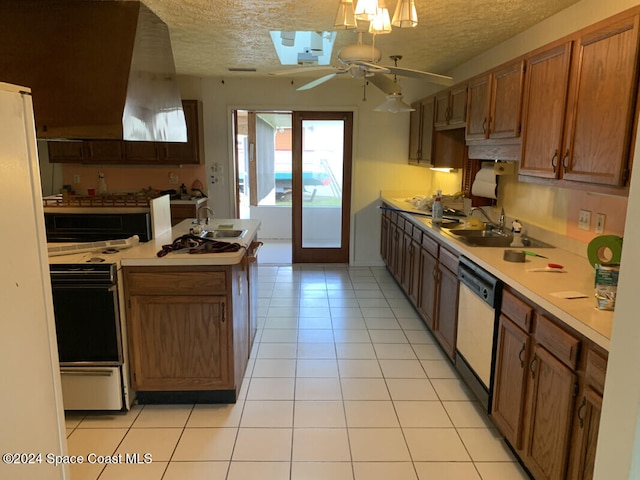 kitchen featuring a textured ceiling, ceiling fan, white dishwasher, and light tile patterned floors