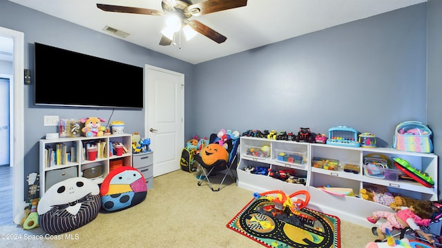 recreation room featuring carpet flooring and ceiling fan