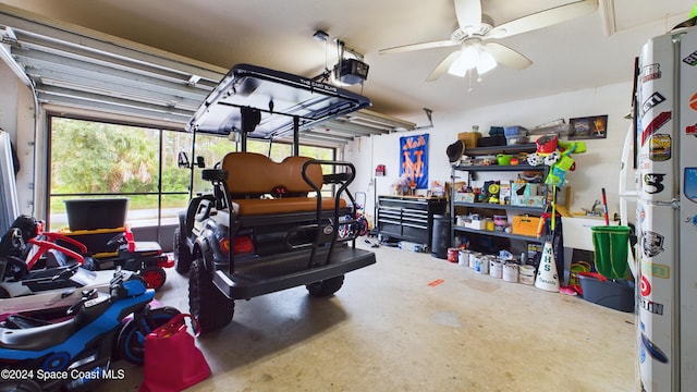 garage featuring ceiling fan and a garage door opener