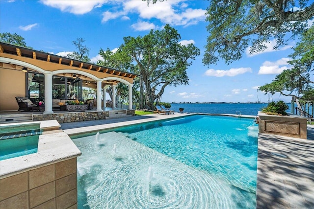808 N Riverside Dr, Indialantic, FL 32903 - outdoor pool with a patio area, a ceiling fan, an in-ground hot tub, and an outdoor hangout area