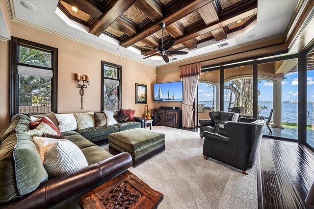 808 N Riverside Dr, Indialantic, FL 32903 - carpeted living room with ornamental molding, beam ceiling, a ceiling fan, and coffered ceiling