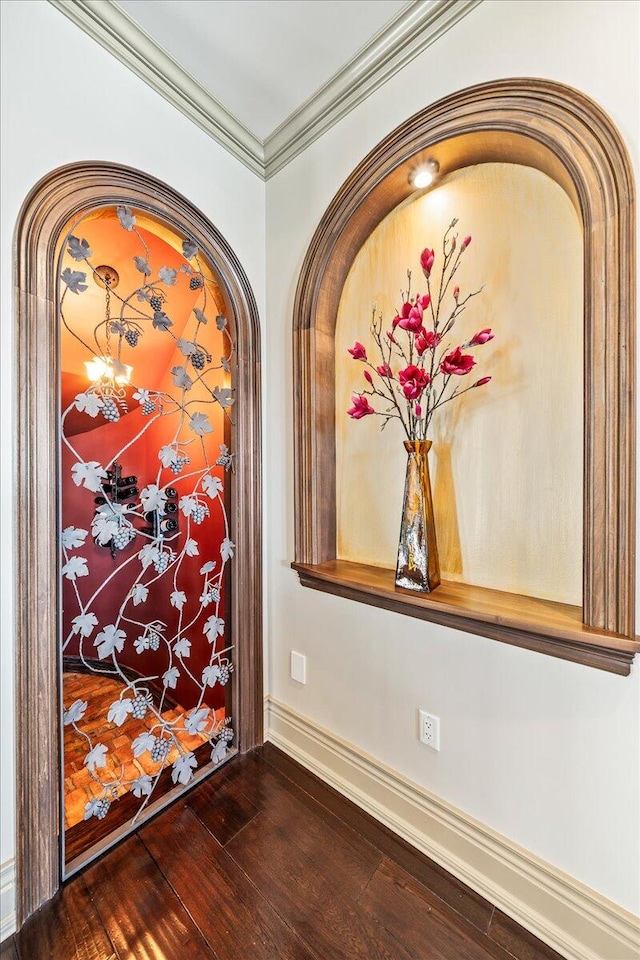 interior details featuring ornamental molding and hardwood / wood-style flooring