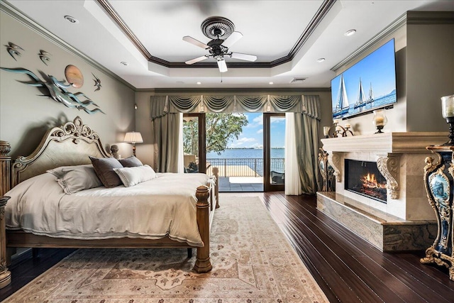 bedroom with dark wood-type flooring, ceiling fan, crown molding, and access to exterior