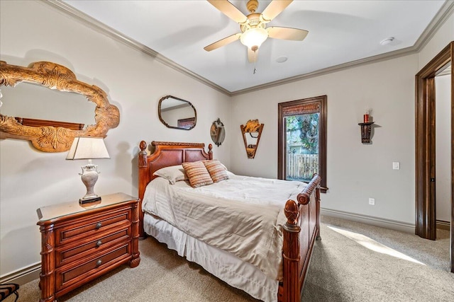 carpeted bedroom featuring ornamental molding and ceiling fan