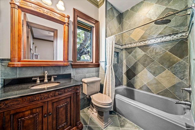 full bathroom with vanity, tile walls, toilet, and shower / bathtub combination with curtain