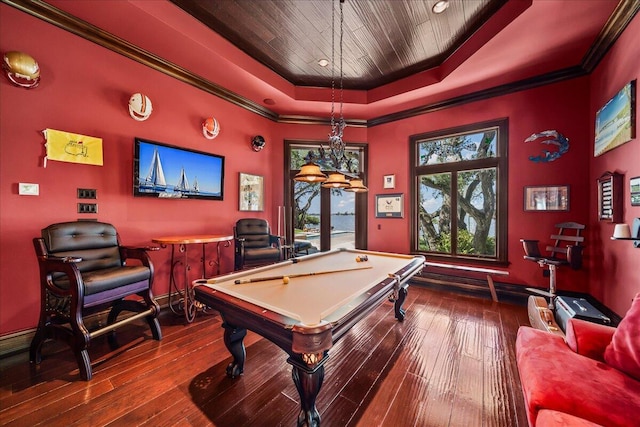 game room featuring hardwood / wood-style floors, pool table, crown molding, and a raised ceiling