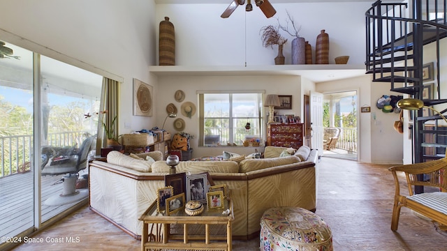 5232 Marina Dr, Bokeelia, FL 33922 - living room with a high ceiling, wood finished floors, ceiling fan, and stairs