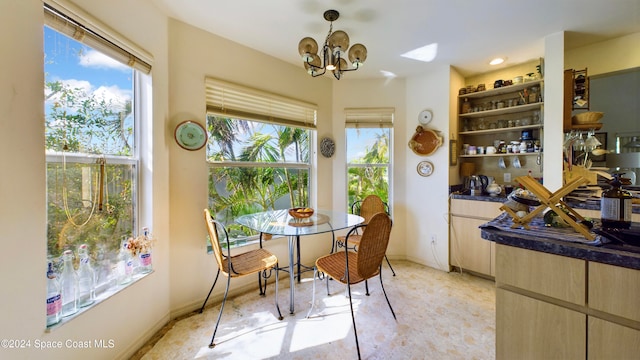 5232 Marina Dr, Bokeelia, FL 33922 - interior space featuring baseboards and a chandelier