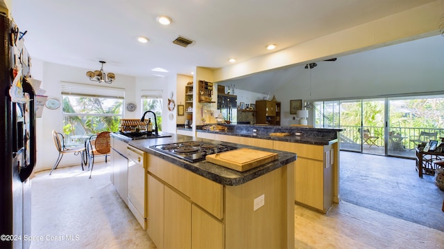 5232 Marina Dr, Bokeelia, FL 33922 - kitchen with modern cabinets, a kitchen island, electric cooktop, and visible vents