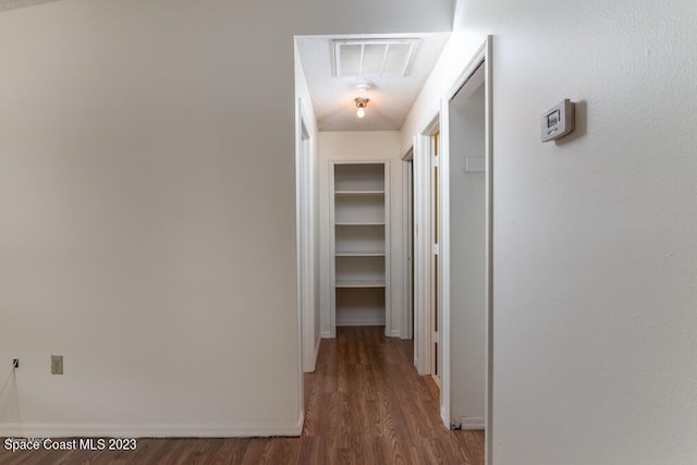 hall with dark hardwood / wood-style floors