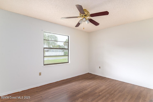 unfurnished room with a textured ceiling, dark hardwood / wood-style flooring, and ceiling fan