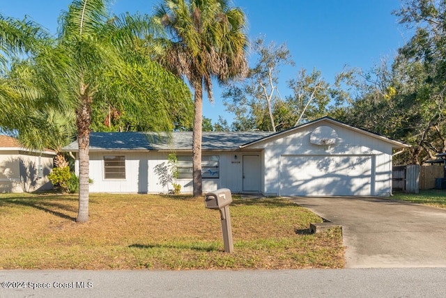 ranch-style house with a front lawn and a garage