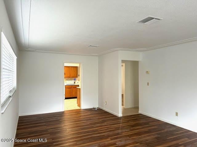 empty room featuring dark hardwood / wood-style floors