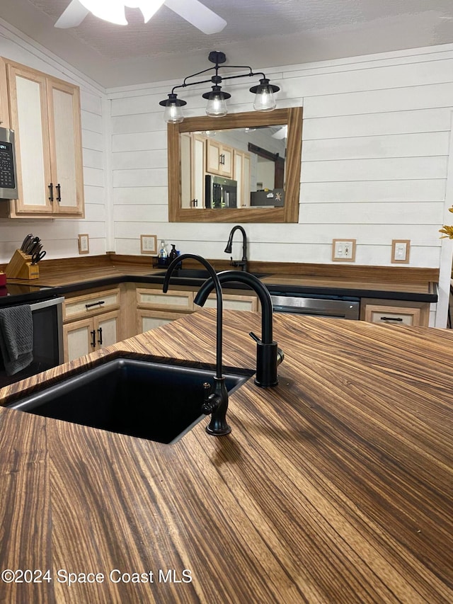 kitchen featuring sink, light brown cabinetry, ceiling fan, and appliances with stainless steel finishes