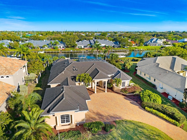 bird's eye view featuring a water view and a residential view