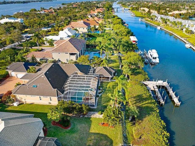 drone / aerial view featuring a water view and a residential view