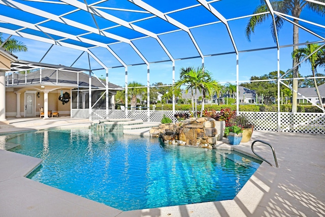 pool with a lanai and a patio