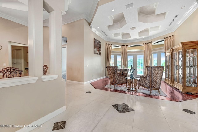 interior space with arched walkways, ornamental molding, and baseboards
