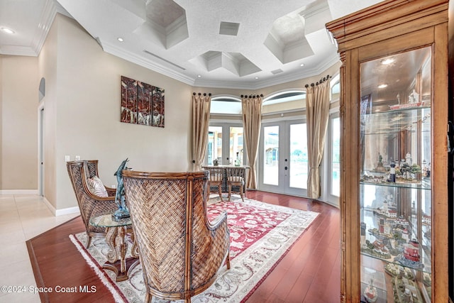 dining area featuring ornamental molding, beamed ceiling, french doors, arched walkways, and coffered ceiling