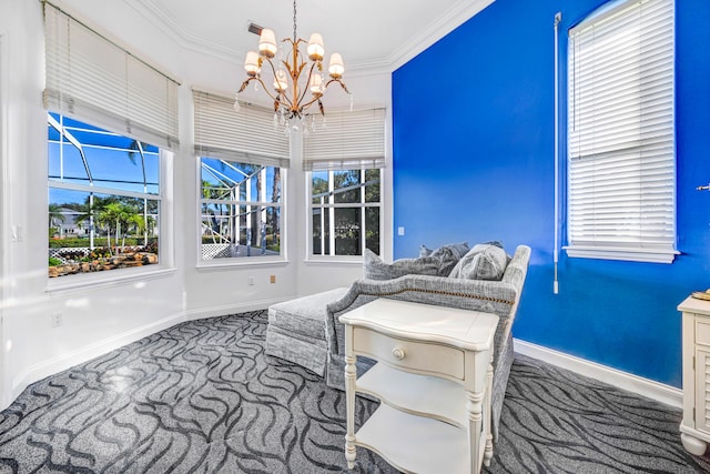 sitting room featuring carpet floors, ornamental molding, baseboards, and a chandelier
