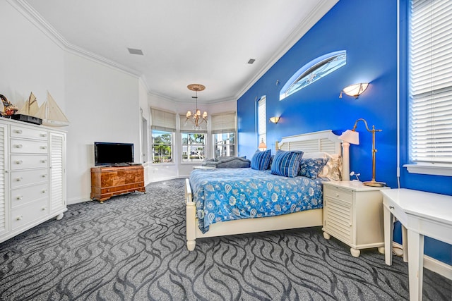 carpeted bedroom with baseboards, a chandelier, ornamental molding, and multiple windows