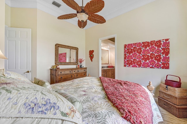 bedroom featuring ornamental molding, ensuite bathroom, wood-type flooring, and ceiling fan