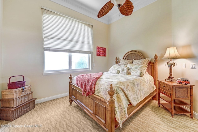 carpeted bedroom with baseboards, ornamental molding, and ceiling fan