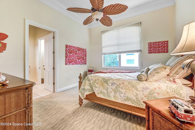 bedroom with baseboards, ornamental molding, ceiling fan, and light carpet