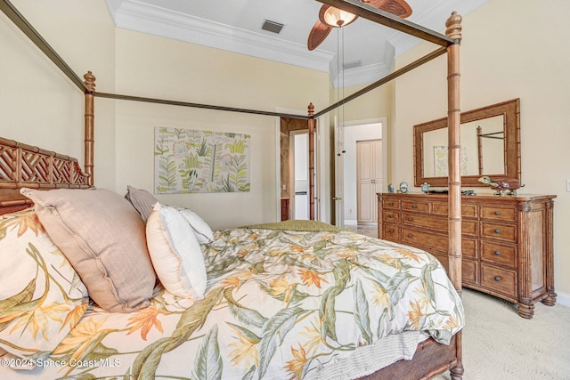 bedroom featuring crown molding, light colored carpet, and ceiling fan